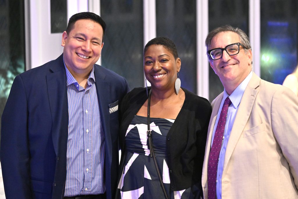BCS Board Member Jerry Rivera (left) at the 2026 fundraising gala with two BCWS employees.